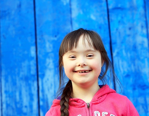 Young girl smiling after special needs dentistry appointment