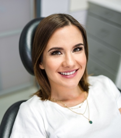 Smiling woman in dentist's office during dental checkup