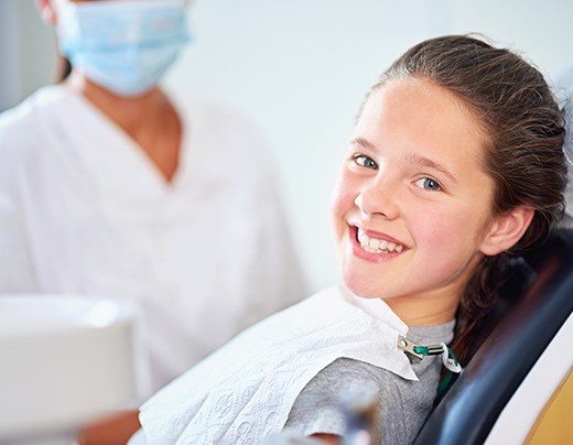 Smiling child after fluoride treatment