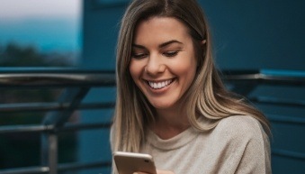 Woman with healthy teeth and gums after periodontal therapy