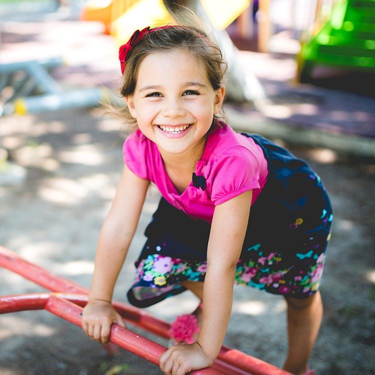 Smiling young girl after children's dentistry