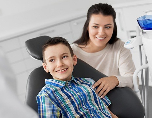 Child smiling after fluoride treatment