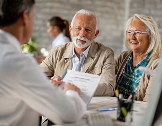 couple at a consultation for implant dentures