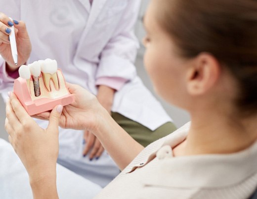 a patient learning how dental implants work in Boerne