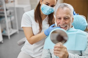 a patient learning how dental implants work in Boerne