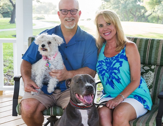 Dr. Luttrell and his wife and their dogs