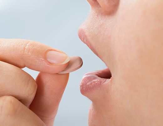 Patient taking oral conscious dental sedation pill