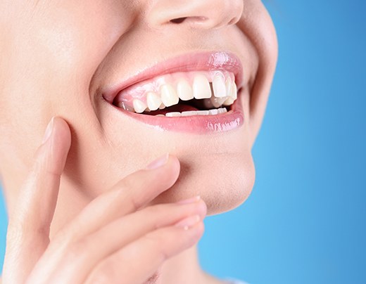 Woman’s smile with gap between the front teeth