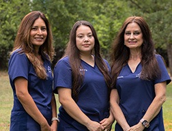 Two dental team members smiling