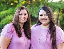 Dental team members smiling together outdoors
