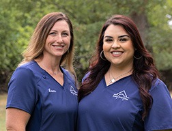 Dental team members smiling together outdoors