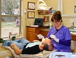 Team member treating dental patient