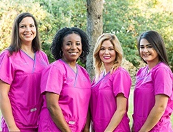 Four dental office team members