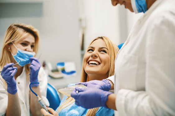 patients talking to dentist at checkup 